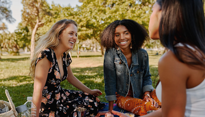 LASIK Patients group of friends at a picnic smiling