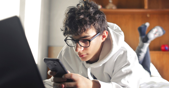 Teen boy with phone