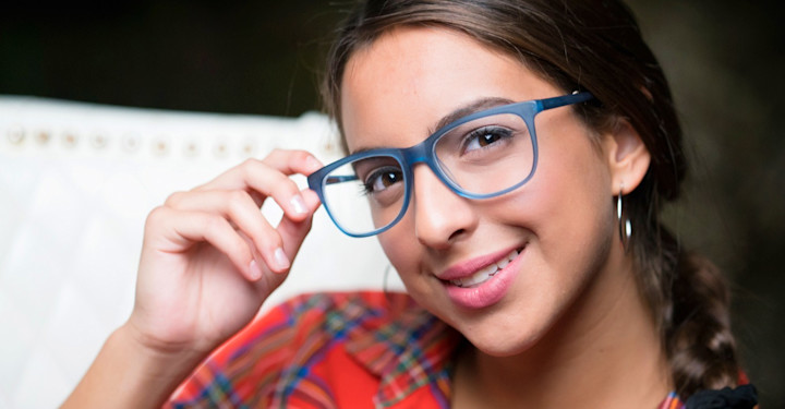 Teen girl with blue frames